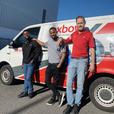 Oxbow drivers beside a branded Oxbow vehicle