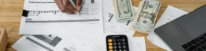 Hands counting banknotes representing reduced managed print costs