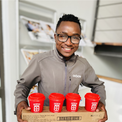 Talent Chemhere serving coffee at Oxbow